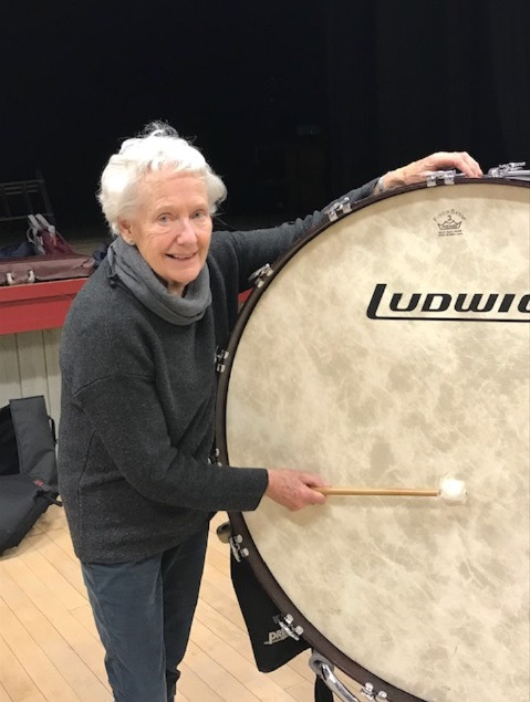 Lady plays bass drum