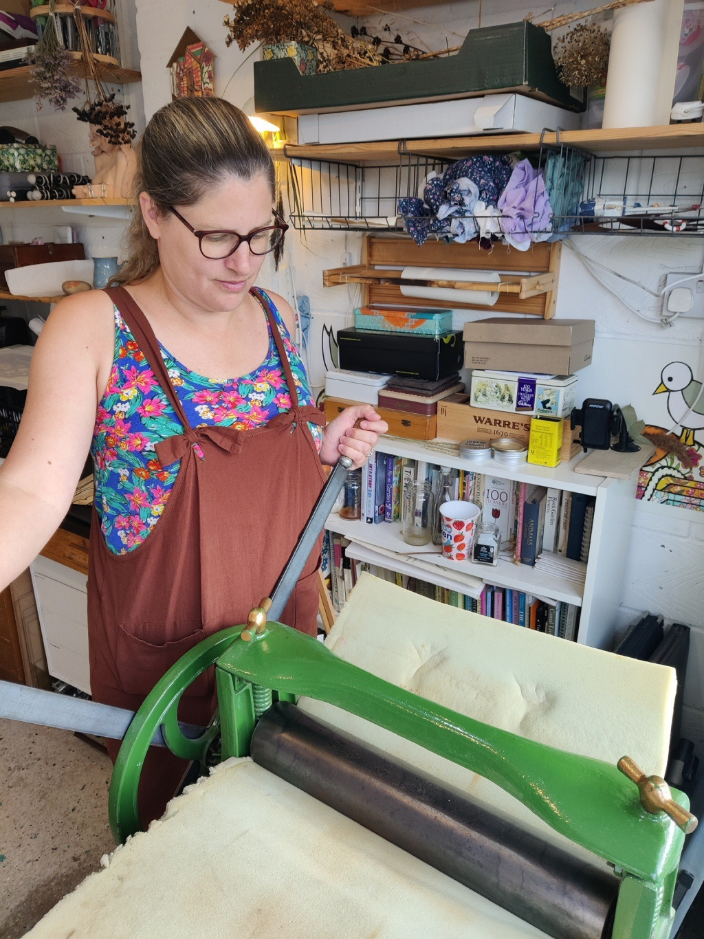 Lady with glasses using printing machine