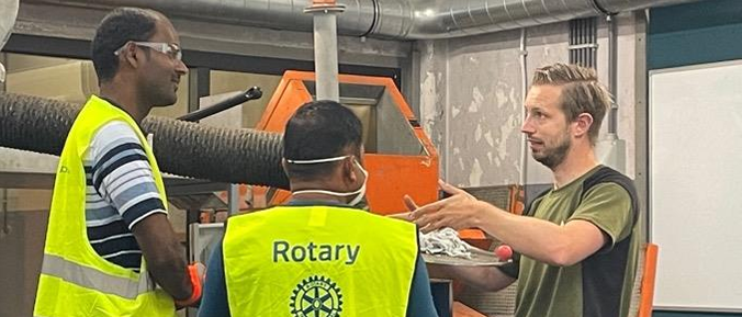 Three men in discussion