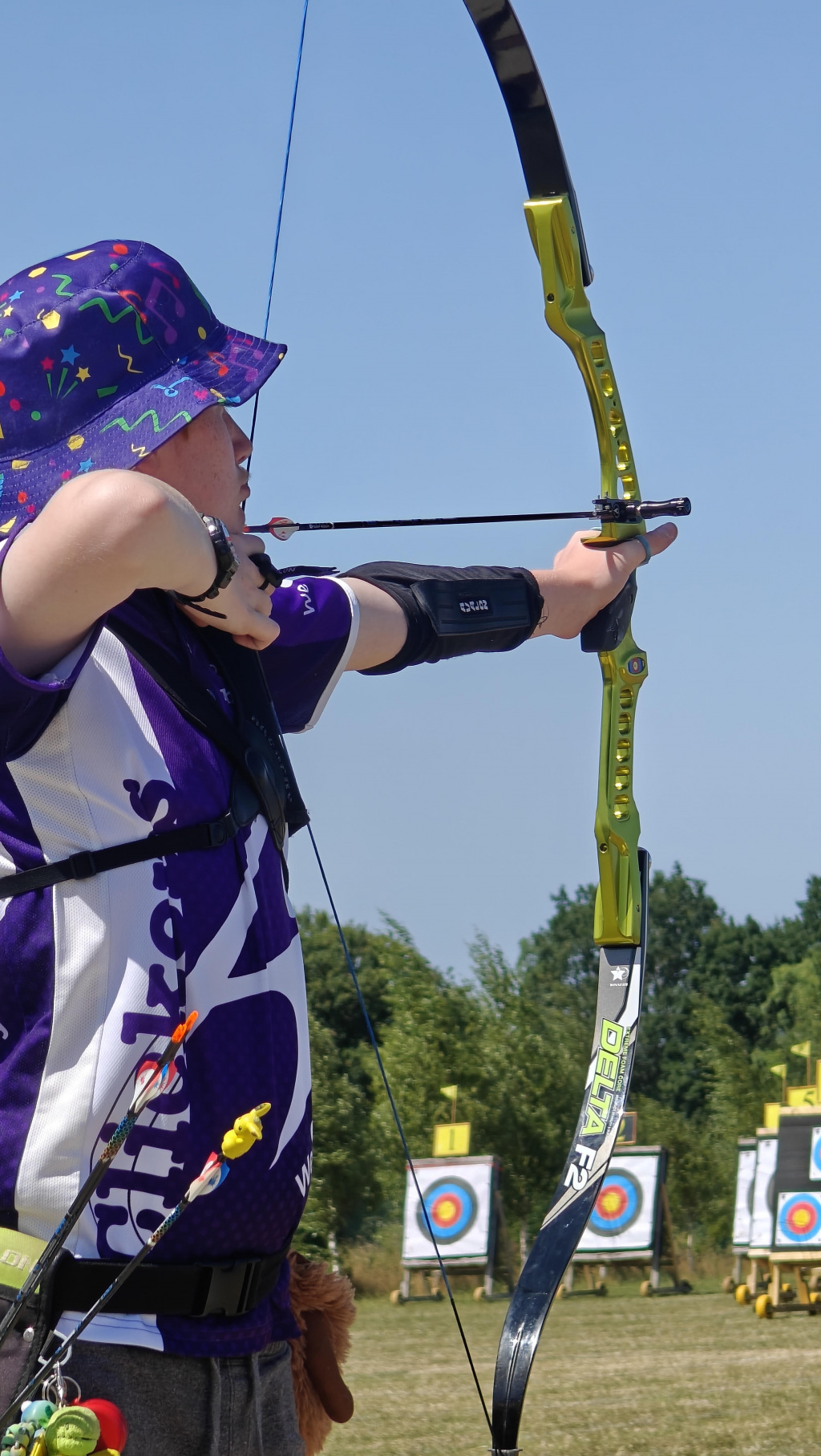 Man holding a bow and arrow in about-to-launch position
