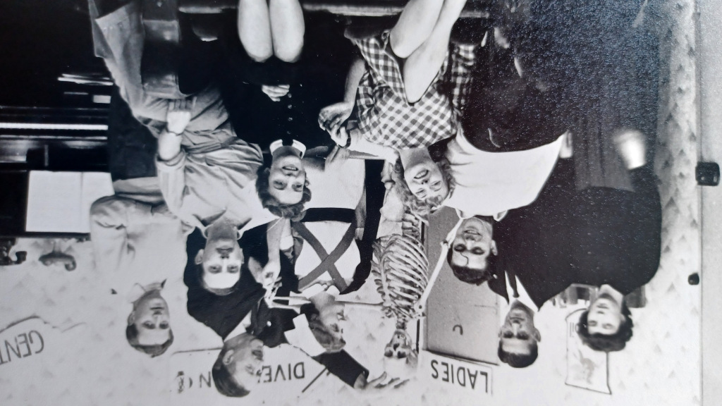 Black-and-white still of women