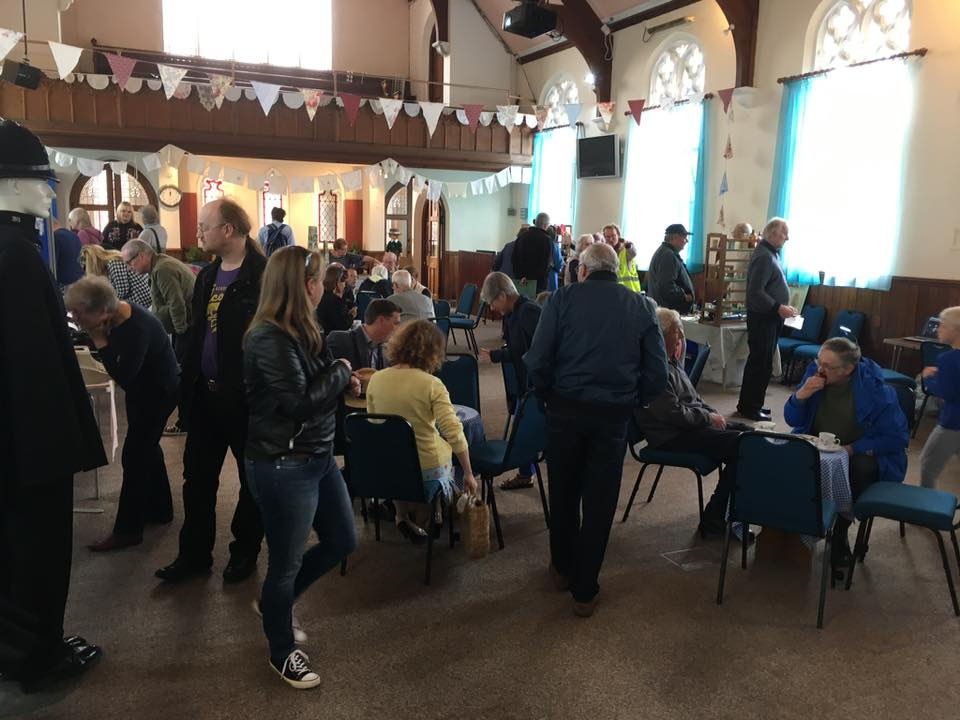 People browsing event in church