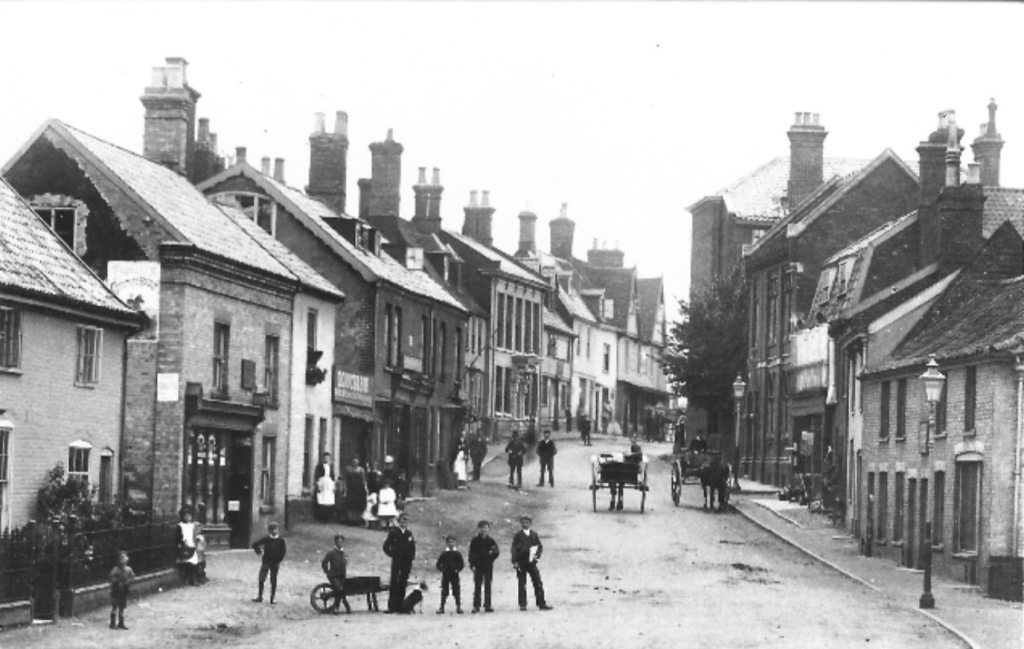 A black-and-white still of a street