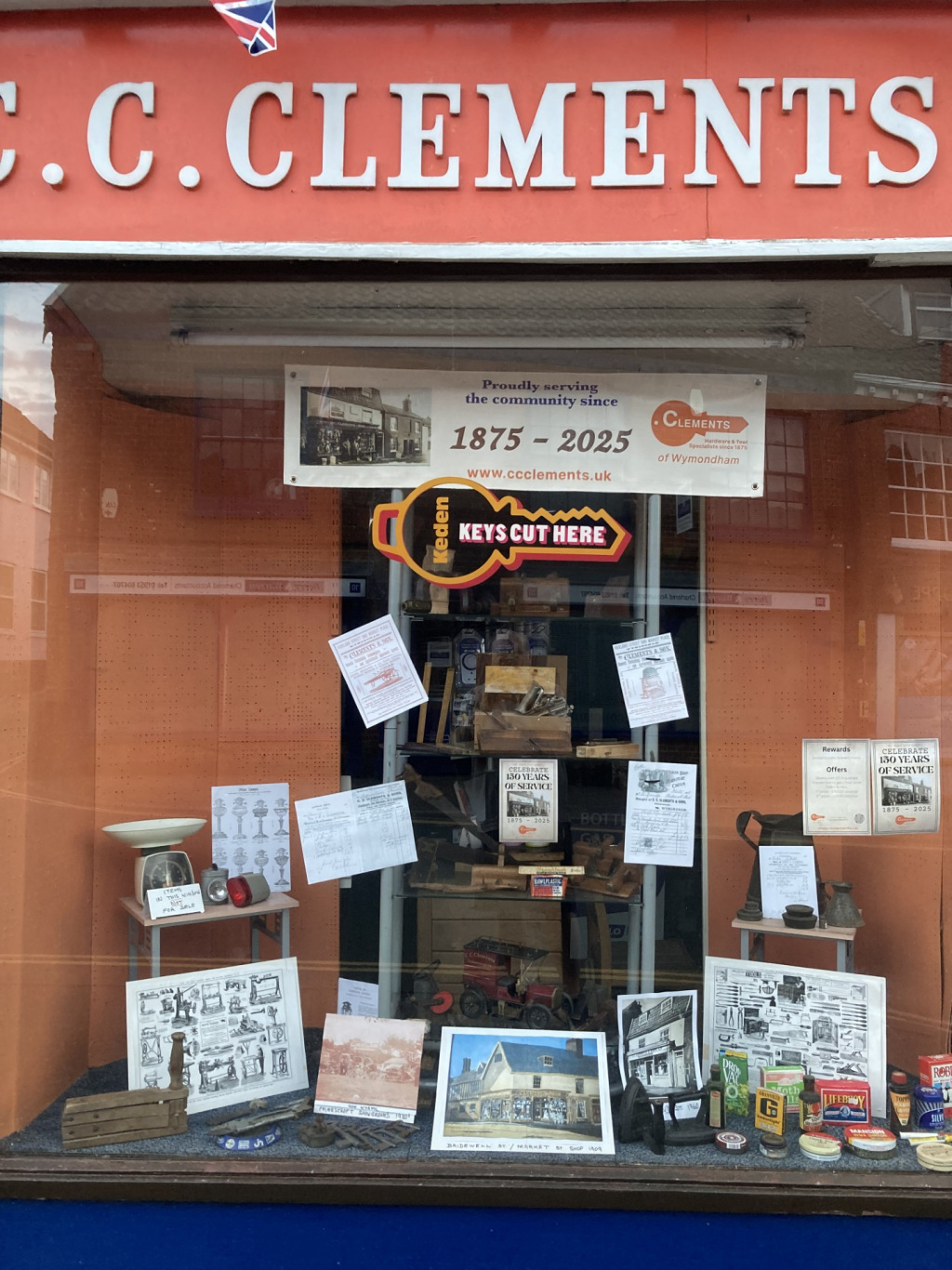 A shop front with the title 'C.C. Clements' above it