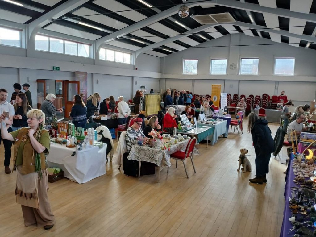 A hall full of stalls and people