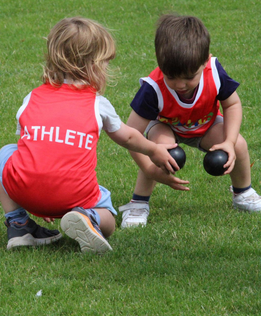 Two children playing ball