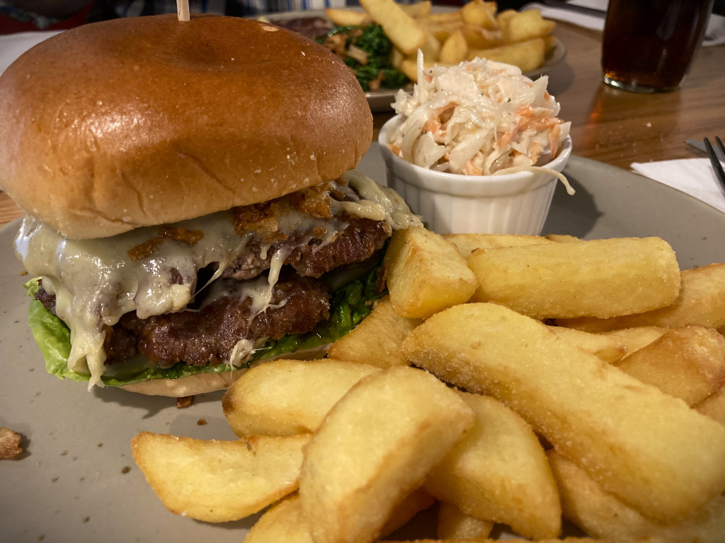 cheeseburger with chips and coleslaw