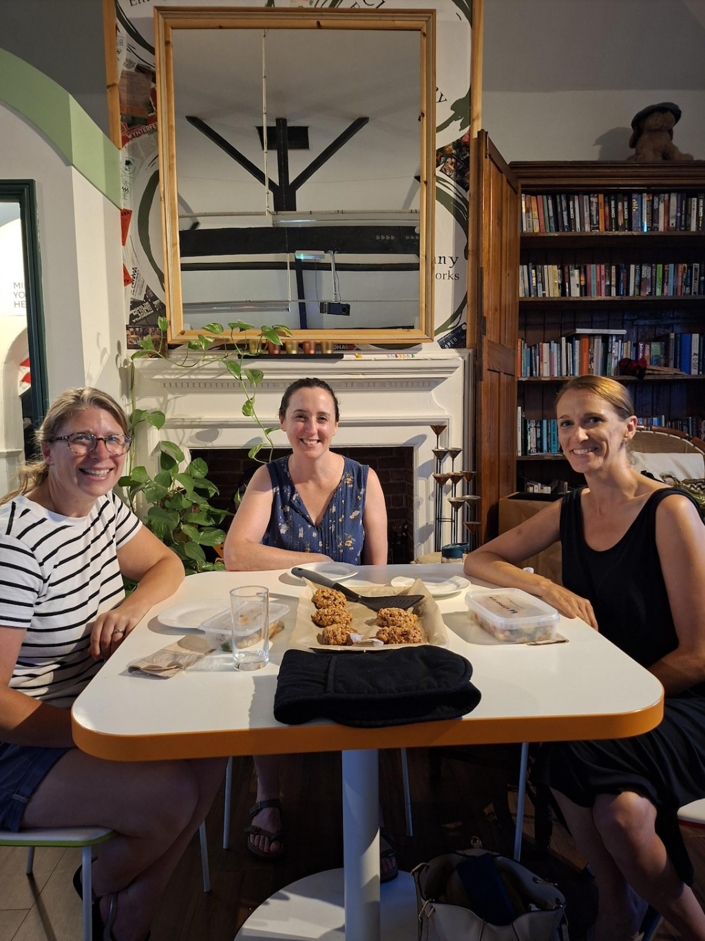 Women around a table with baked goods