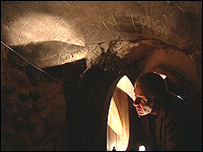 Man in a tunnel searching for spiders