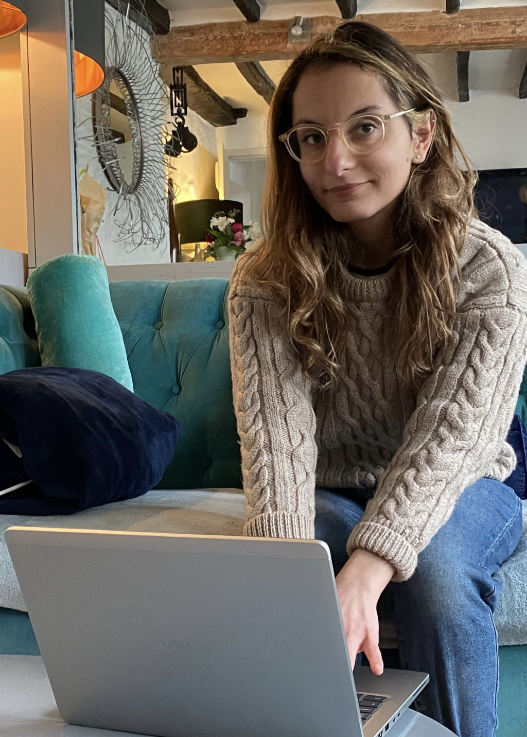 Woman sitting with a laptop