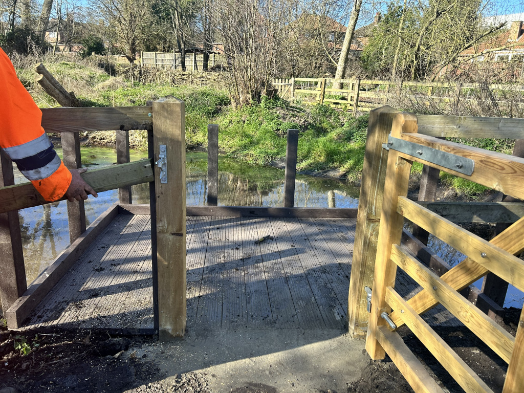 An outdoor area ringed by fences