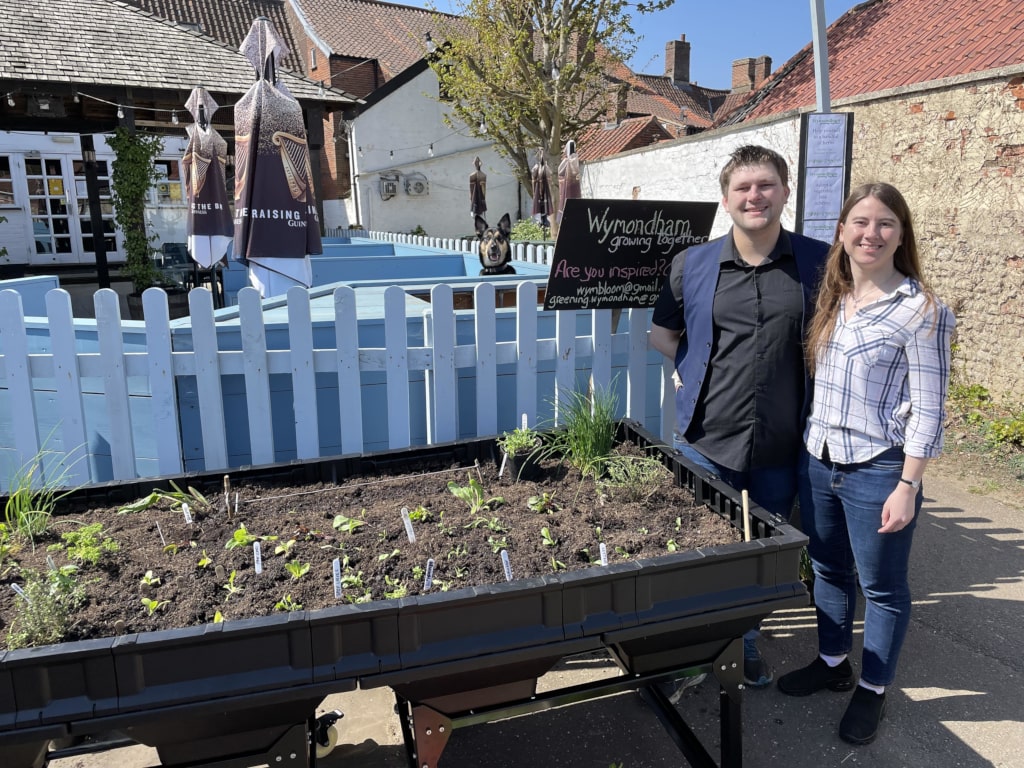 Couple next to Greening Wymondham stall