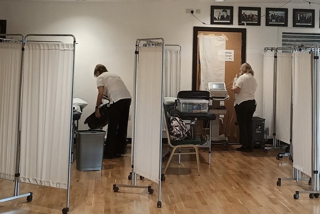 health screening area with white screens