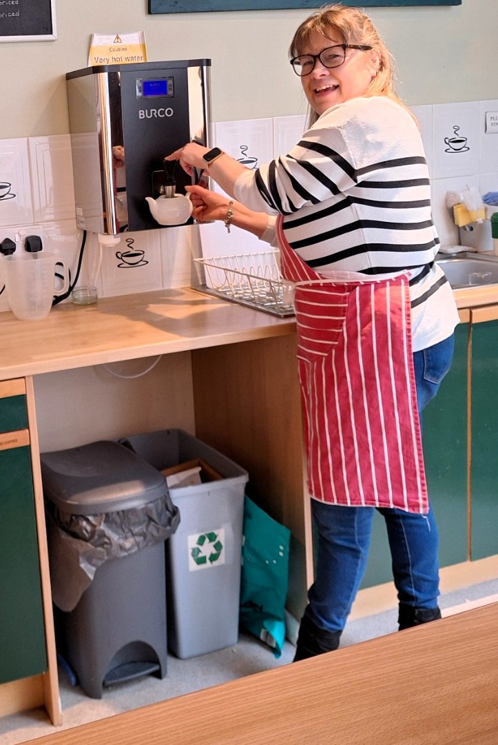 Woman at a coffee machine