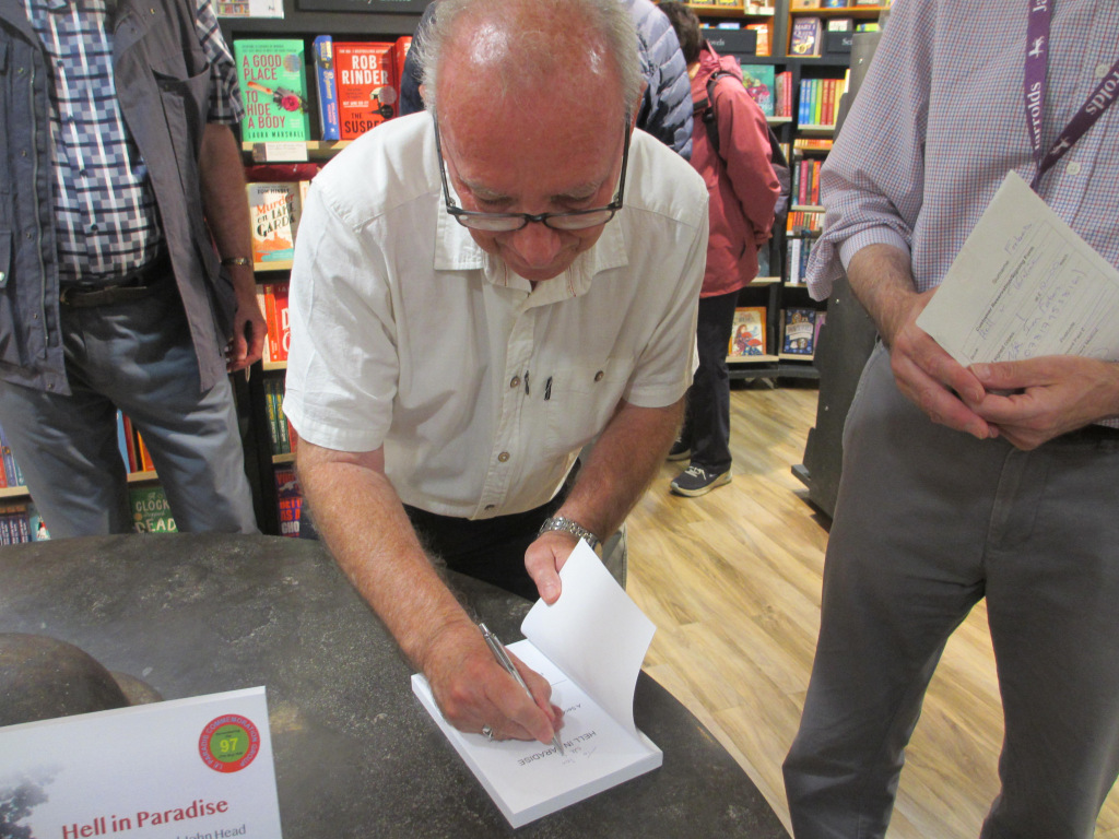 Peter Steward signing a book
