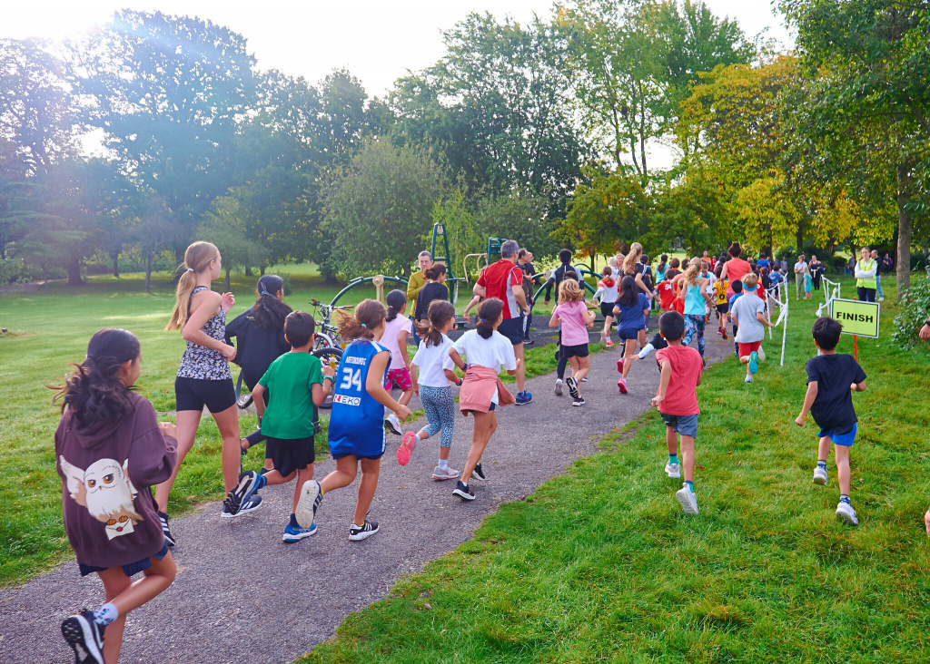 Children running along a path