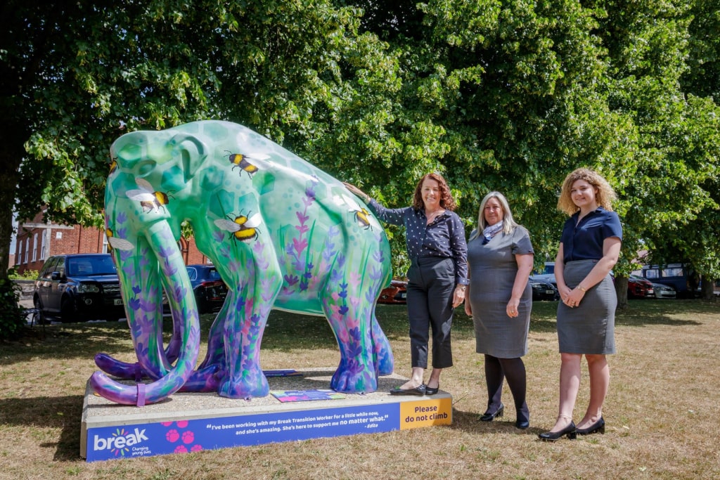 Mammoth statue with women