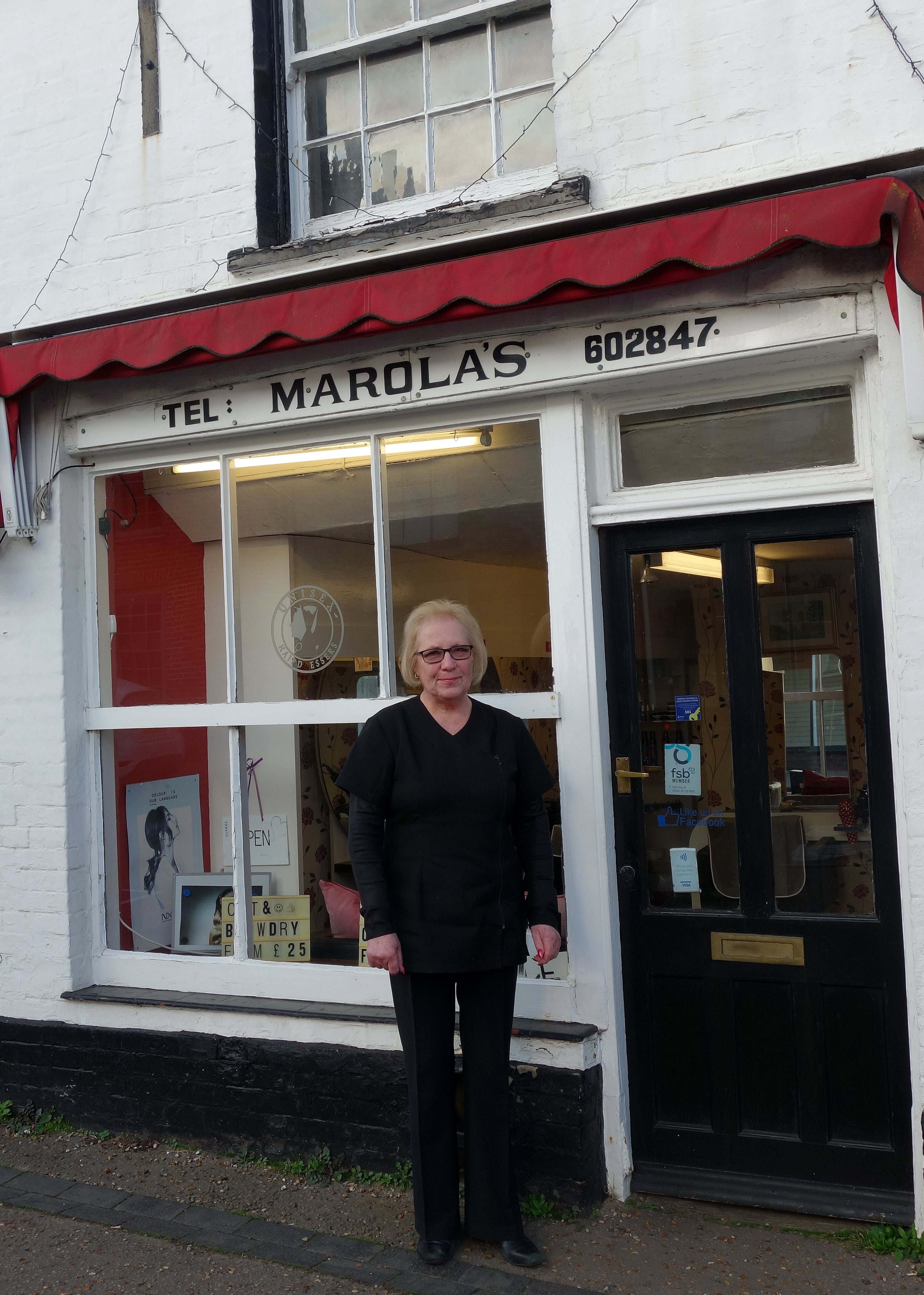 Mary standing outside of Marola's salon