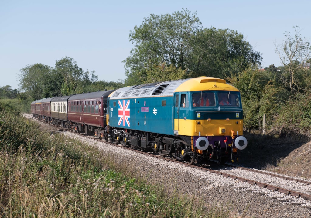 MNR's 47580 'County of Essex' approaches Wymondham Abbey station