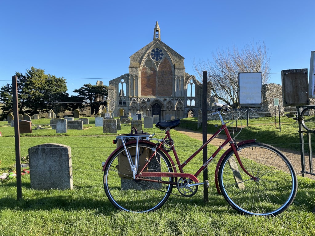An elderly bicycle at a churchyard
