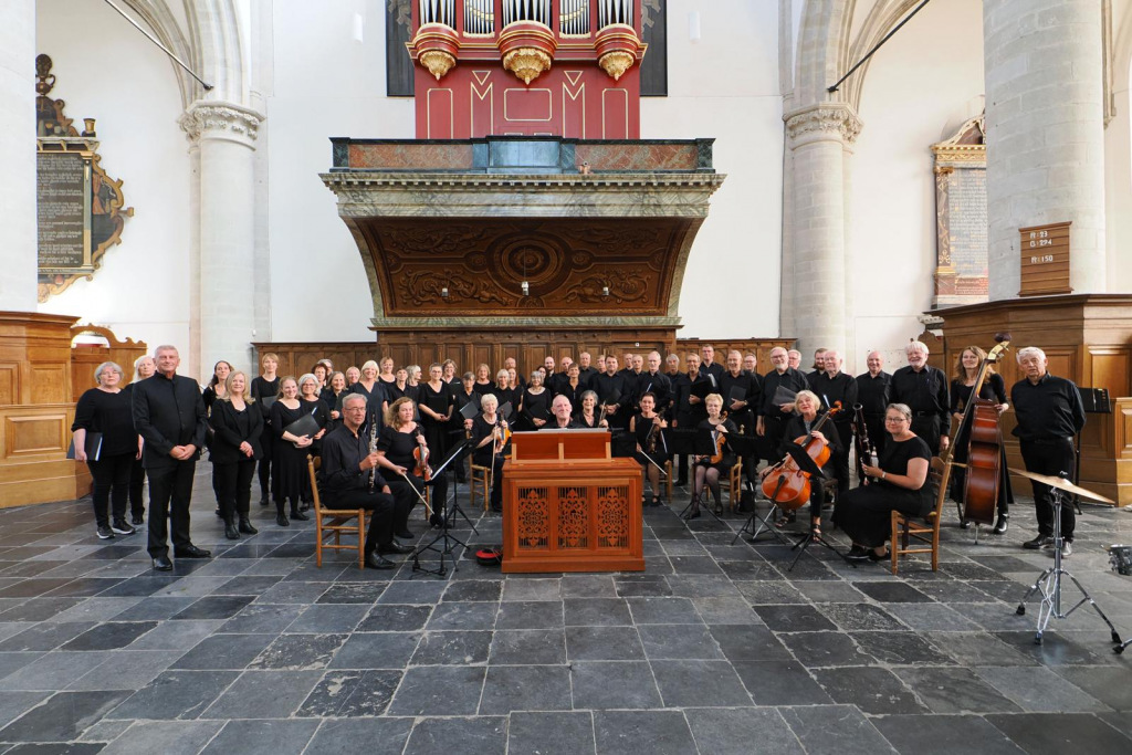 A group of people in black tie in a religious building