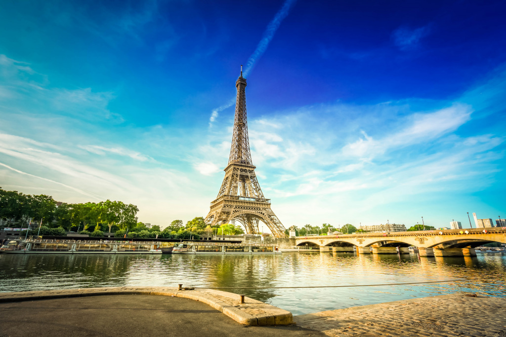 Eiffel tower with blue sky and river