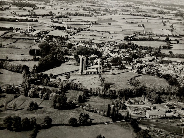 Black and white still of a town shot from above