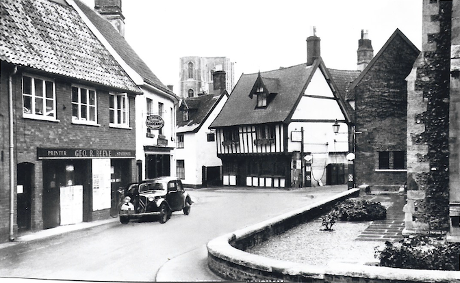 Black-and-white still of a street