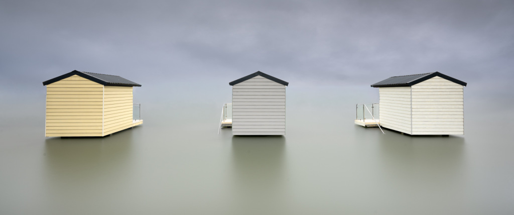 Three houses on the water