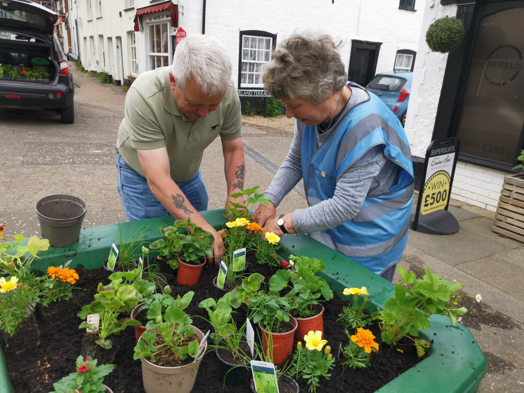 Volunteers planting flowers