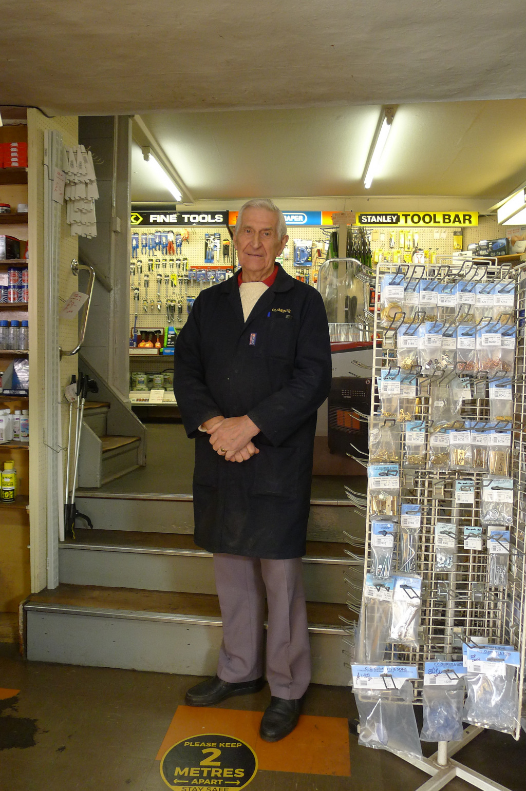 George standing in shop
