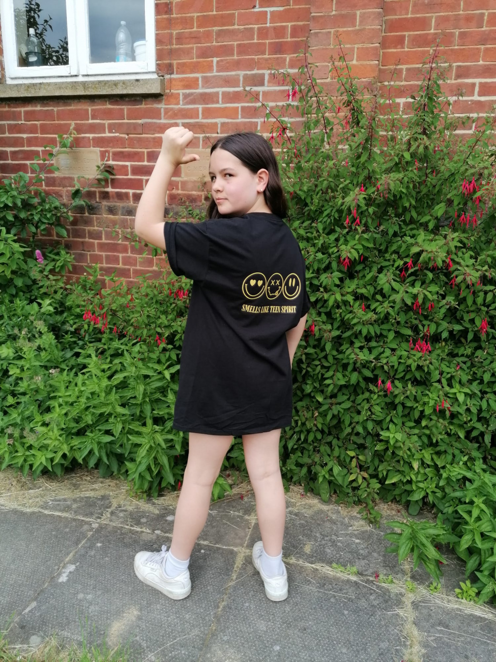Girl posing in a punching-air position