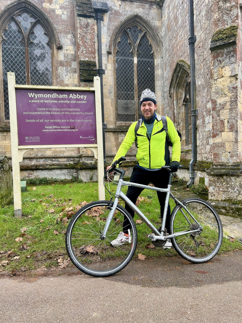 Cyclist standing in front of Abbey