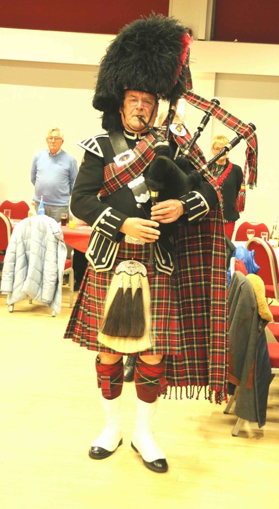 Piper with his bagpipes