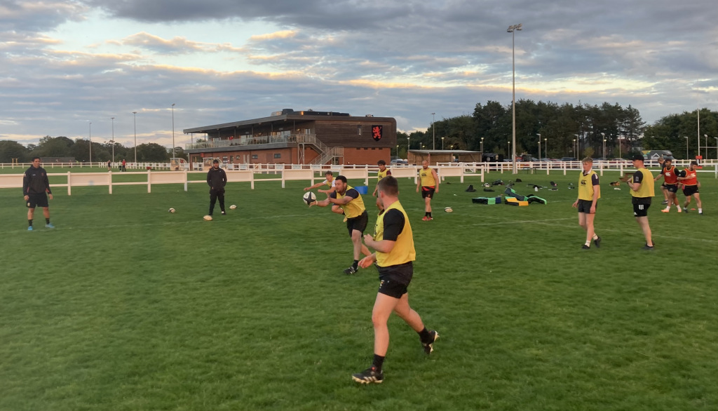 Men playing rugby