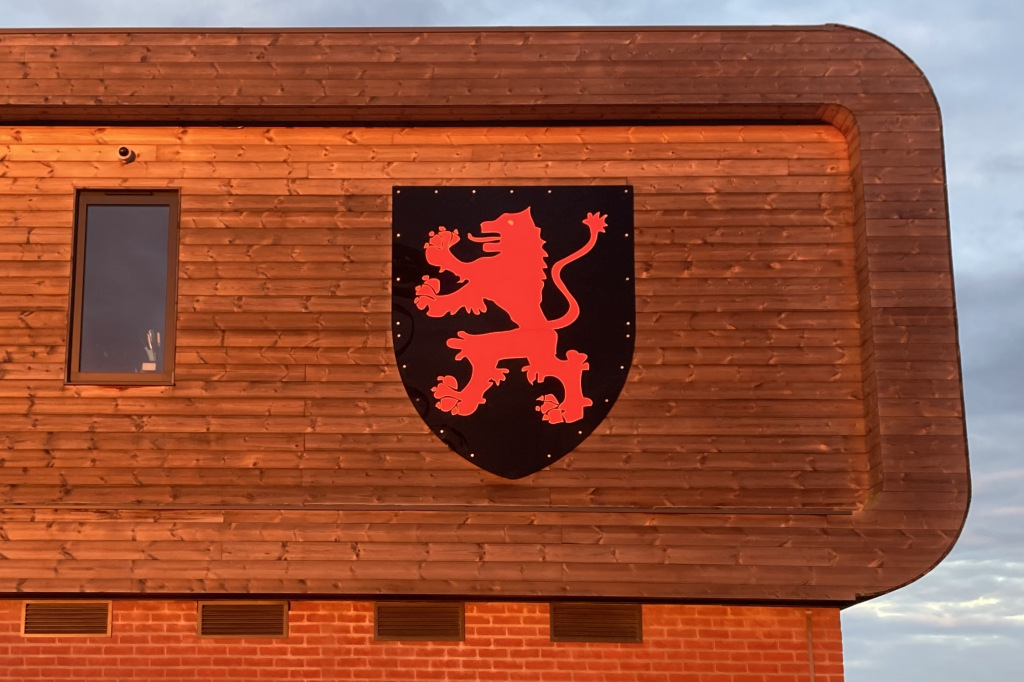 Wymondham Rugby Football Club logo on building