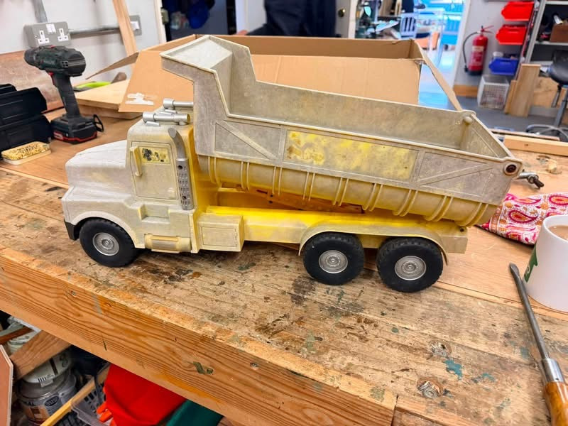 A toy truck in bad repair
