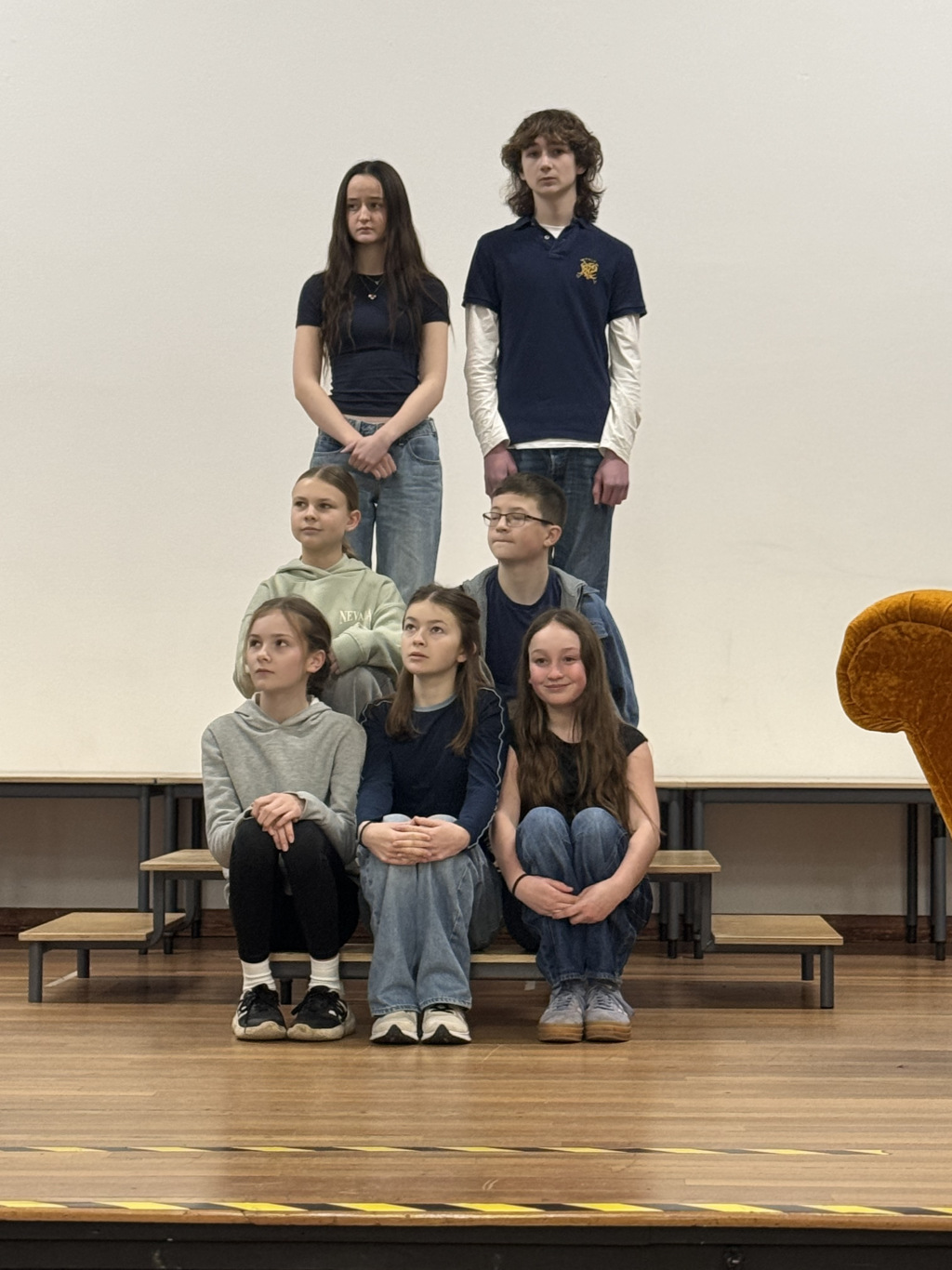 Children standing onstage like the von Trapp children