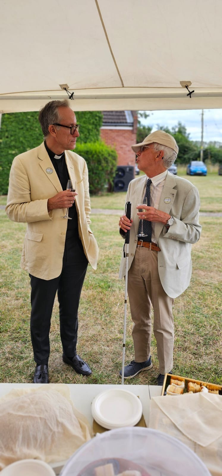 Two men talking over drinks