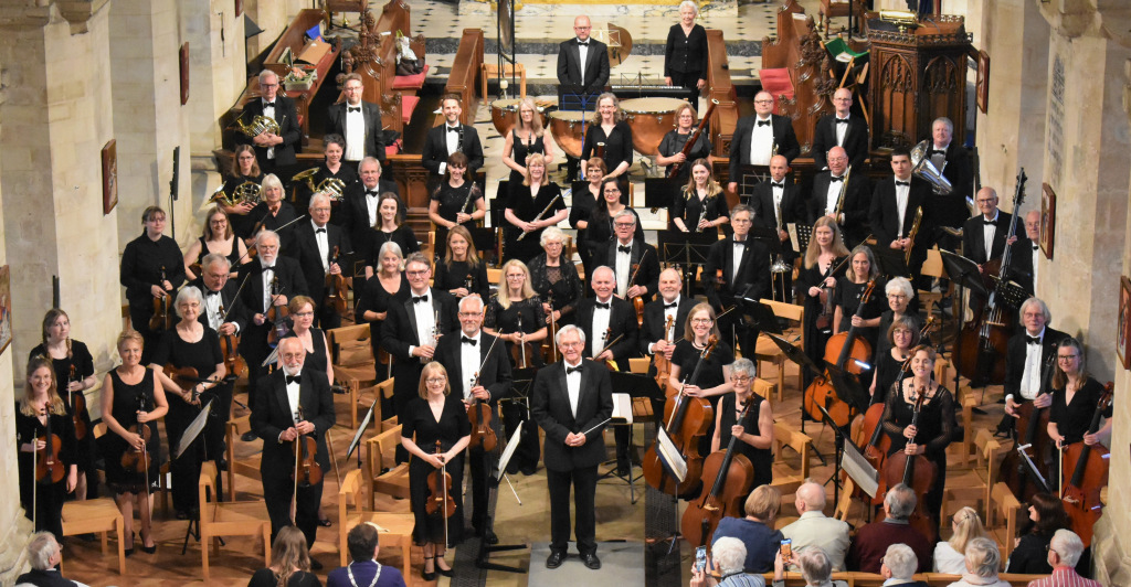 Symphony orchestra standing up in Abbey