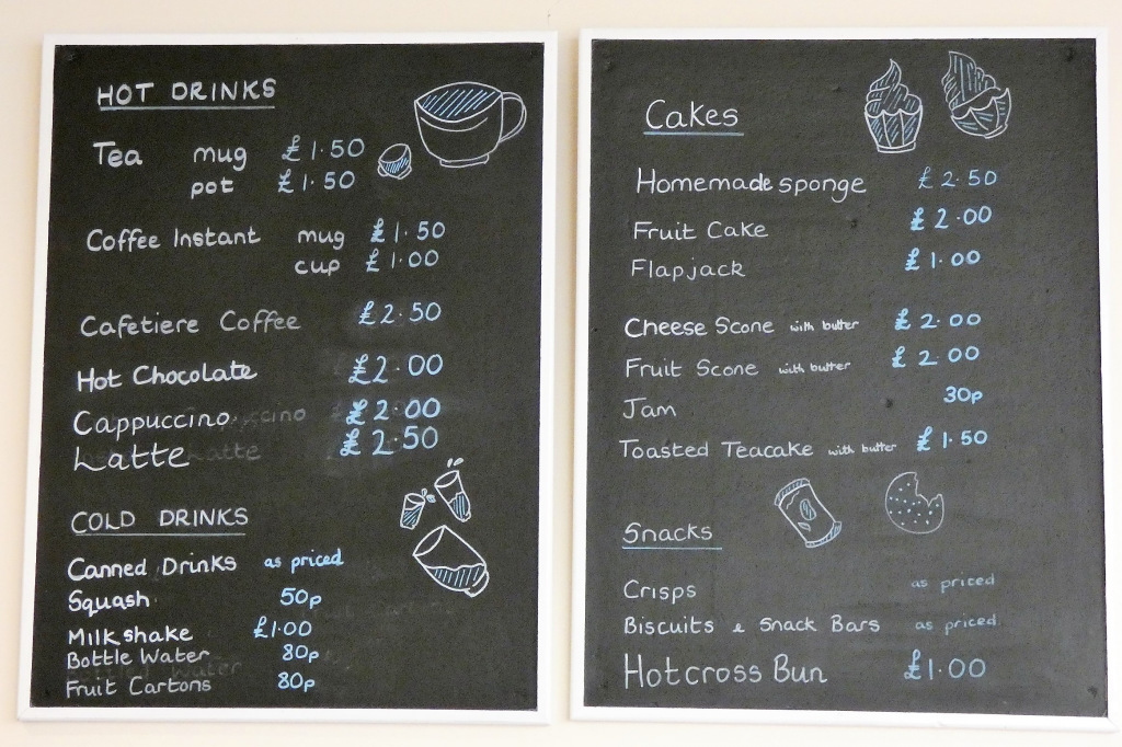 Menu and prices at the tearoom written on a blackboard