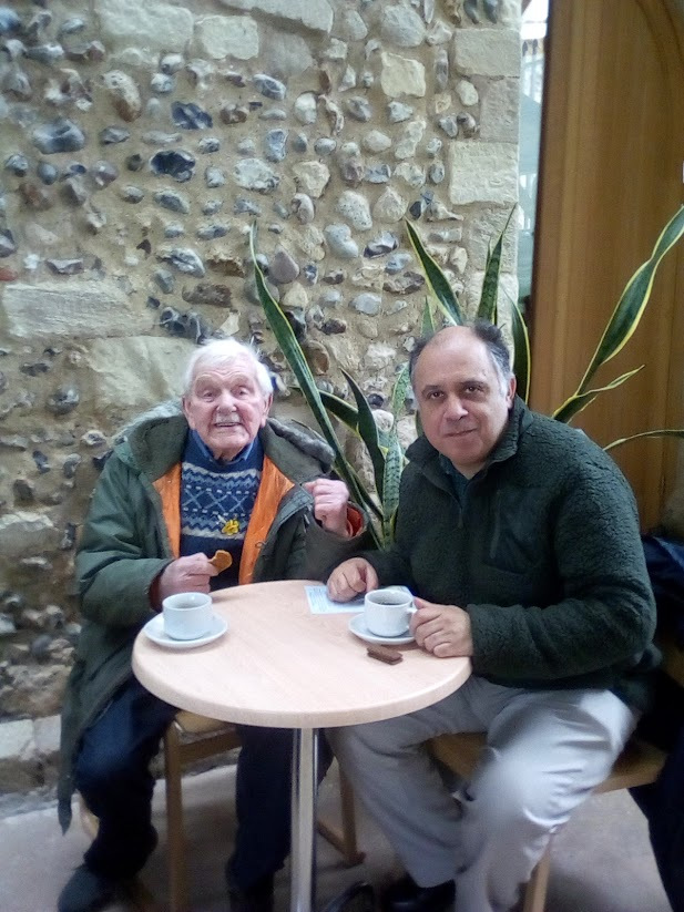 Two men drinking tea in Abbey
