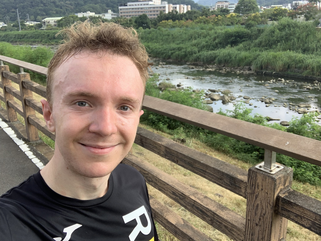 Man standing by a river