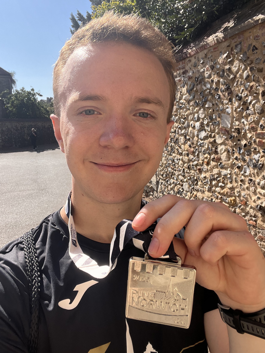 Man holding a medal
