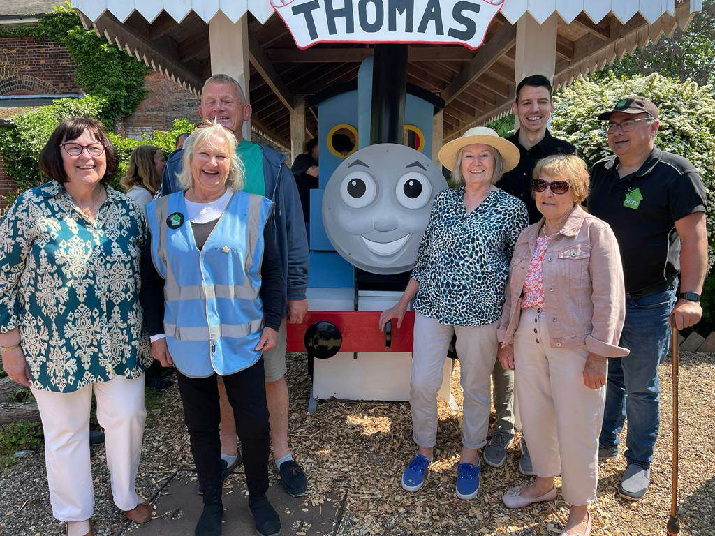 Bloom group standing with the reopened Thomas the Tank Engine