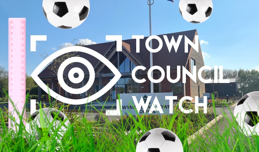 Town Council headquarters with long grass and footballs