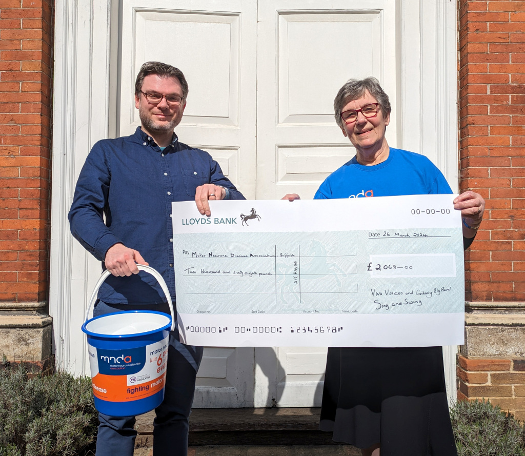 men holding big cheque for fundraiser