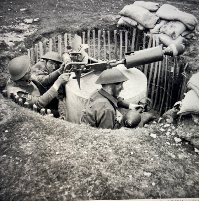 soldiers in world war 2 practicing with spigot mortar