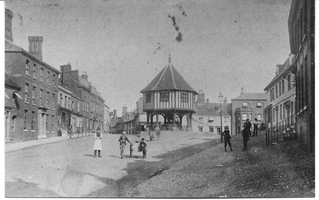 Old black and white photo of Wymondham market street
