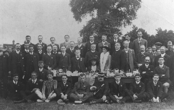 Men sitting together for a photo